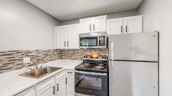 Updated kitchen with white appliances